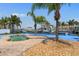 Backyard with a small pool, patio area, and waterfront access with boat dock at 13810 Celida Ave, Hudson, FL 34667