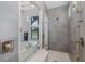 Modern bathroom boasts a soaking tub and separate glass-enclosed shower with luxury fixtures at 16557 Acoustic Loop, Land O Lakes, FL 34638