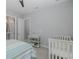 Bedroom features a crib and changing table at 16557 Acoustic Loop, Land O Lakes, FL 34638
