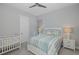 Charming bedroom with crib and striped bedding at 16557 Acoustic Loop, Land O Lakes, FL 34638
