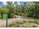 Community canopy trail entrance with trail length information on the sign at 16557 Acoustic Loop, Land O Lakes, FL 34638