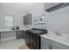 Functional laundry room features modern appliances and ample counter space at 16557 Acoustic Loop, Land O Lakes, FL 34638