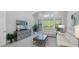 Bright living room features modern furniture, neutral colors, and a large screen television at 16557 Acoustic Loop, Land O Lakes, FL 34638