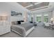 Spacious main bedroom features a decorative tray ceiling and sitting area with large windows at 16557 Acoustic Loop, Land O Lakes, FL 34638