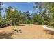 Recreational area featuring green exercise equipment, swings, and a walking path, perfect for outdoor fitness and enjoyment at 16557 Acoustic Loop, Land O Lakes, FL 34638