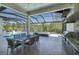 An inviting screened lanai with a pool, hot tub, outdoor kitchen and dining area, perfect for entertaining at 16557 Acoustic Loop, Land O Lakes, FL 34638