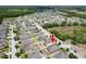 Aerial view of property in quiet neighborhood featuring mature landscaping and convenient access to roads at 18353 Briar Oaks Dr, Hudson, FL 34667
