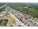 Wide aerial shot of neighborhood showcasing the mature trees and proximity to main thoroughfare at 18353 Briar Oaks Dr, Hudson, FL 34667