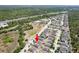 An aerial view of a property featuring mature landscaping, and access to nearby highway at 18353 Briar Oaks Dr, Hudson, FL 34667