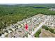 Aerial view of neighborhood with lush greenery and homes in a suburban setting at 18353 Briar Oaks Dr, Hudson, FL 34667