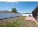 Home exterior showing patio with an open backyard and privacy fence at 18353 Briar Oaks Dr, Hudson, FL 34667