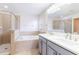 Bathroom featuring a separate tiled shower and soaking tub at 18353 Briar Oaks Dr, Hudson, FL 34667