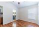 Bedroom with hardwood floors and access to en-suite bathroom at 18353 Briar Oaks Dr, Hudson, FL 34667