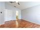 Spacious bedroom with laminate wood floors and ensuite bathroom entrance at 18353 Briar Oaks Dr, Hudson, FL 34667