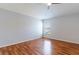 Laminate wood flooring in bedroom with window at 18353 Briar Oaks Dr, Hudson, FL 34667