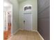 Inviting foyer with tile flooring, and a decorative accent wall creates an elegant and welcoming entryway at 18353 Briar Oaks Dr, Hudson, FL 34667