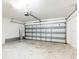 Spacious two-car garage featuring a concrete floor and an automatic garage door at 18353 Briar Oaks Dr, Hudson, FL 34667