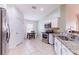 Well-lit kitchen with stainless steel appliances and breakfast nook at 18353 Briar Oaks Dr, Hudson, FL 34667