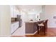 Open kitchen featuring stainless steel appliances, granite countertops, and breakfast bar at 18353 Briar Oaks Dr, Hudson, FL 34667