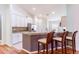 Bright kitchen featuring granite countertops and stainless steel refrigerator at 18353 Briar Oaks Dr, Hudson, FL 34667