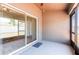 Covered patio with sliding glass doors and screened enclosure, perfect for outdoor enjoyment at 18353 Briar Oaks Dr, Hudson, FL 34667
