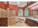 Bathroom with floral wallpaper, tiled floor, walk in shower, and large tub at 18502 Winding Oaks Blvd, Hudson, FL 34667