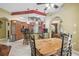 Cozy dining room adjacent to an open kitchen and featuring a breakfast table at 18502 Winding Oaks Blvd, Hudson, FL 34667