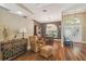 Dining room featuring hardwood floors, designer wallpaper, and natural light at 18502 Winding Oaks Blvd, Hudson, FL 34667