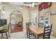 Cozy dining room featuring a wood table with a view to the living area at 18502 Winding Oaks Blvd, Hudson, FL 34667