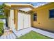 Exterior with shed and lush backyard, offering ample storage and outdoor space at 18502 Winding Oaks Blvd, Hudson, FL 34667