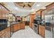 Open kitchen featuring granite countertops, stainless steel appliances, and ample cabinet space at 18502 Winding Oaks Blvd, Hudson, FL 34667