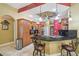 Spacious kitchen featuring granite countertops, stainless steel appliances, and breakfast bar seating at 18502 Winding Oaks Blvd, Hudson, FL 34667