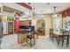 Spacious kitchen featuring granite countertops, stainless steel appliances, and breakfast bar seating at 18502 Winding Oaks Blvd, Hudson, FL 34667