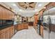 Open kitchen featuring granite countertops, stainless steel appliances, and ample cabinet space at 18502 Winding Oaks Blvd, Hudson, FL 34667