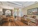 Spacious living room with hardwood floors, a fireplace, and an open layout at 18502 Winding Oaks Blvd, Hudson, FL 34667