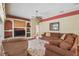 Comfortable living room with built-in shelving, large rug and comfortable furniture at 18502 Winding Oaks Blvd, Hudson, FL 34667