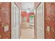 Spa-like primary bathroom features a soaking tub, bright light, and patterned wallpaper at 18502 Winding Oaks Blvd, Hudson, FL 34667