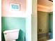 Small, tiled bathroom offers a tub and shower combination at 1919 Harpoon Dr, Holiday, FL 34690