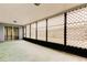 Large, enclosed patio space with lattice panels and access to the yard at 1919 Harpoon Dr, Holiday, FL 34690