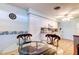 Bright kitchen with white cabinets and plenty of counter space and adjacent dining area at 1919 Harpoon Dr, Holiday, FL 34690