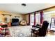 Cozy living room featuring a large sliding glass doors and comfortable seating at 1919 Harpoon Dr, Holiday, FL 34690