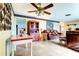 Spacious living room featuring tile flooring, ceiling fan and comfortable seating at 1919 Harpoon Dr, Holiday, FL 34690