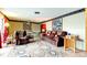 Bright living room featuring plush seating, decorative rug and ceiling fan at 1919 Harpoon Dr, Holiday, FL 34690