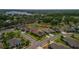 Aerial view showcasing a neighborhood, lush greenery and a large lake in the background at 22118 Yachtclub Ter, Land O Lakes, FL 34639