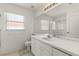 Well-lit bathroom featuring a single sink vanity and shower-tub combo at 22118 Yachtclub Ter, Land O Lakes, FL 34639