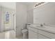 Bright bathroom featuring a large mirror, white vanity, and a walk in shower at 22118 Yachtclub Ter, Land O Lakes, FL 34639
