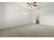 Bedroom featuring plush carpet, ceiling fan, and access to en-suite bathroom at 22118 Yachtclub Ter, Land O Lakes, FL 34639