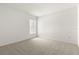 Neutral carpeted bedroom with a window providing natural light at 22118 Yachtclub Ter, Land O Lakes, FL 34639