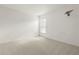 Empty carpeted bedroom with a window and electrical outlets at 22118 Yachtclub Ter, Land O Lakes, FL 34639