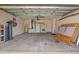 View of a spacious two car garage with concrete flooring and white walls at 22118 Yachtclub Ter, Land O Lakes, FL 34639